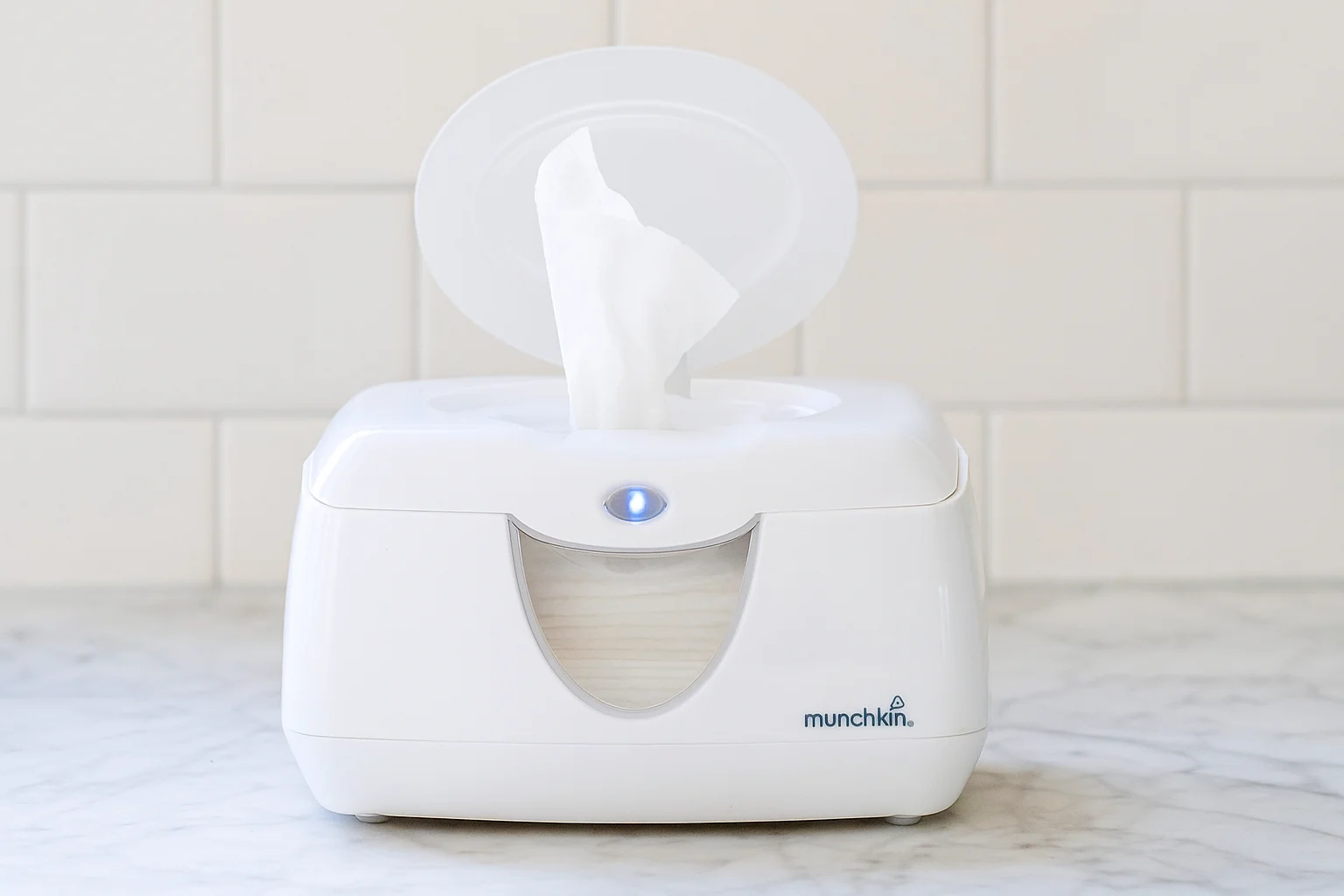 Munchkin Warm Glow Wipe Warmer with lid open on a marble countertop